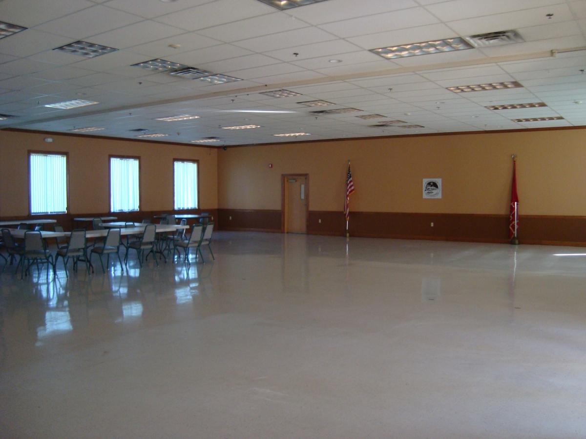 large room with tables and chairs