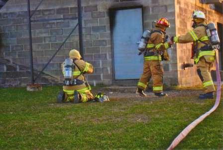 firefighters with hose