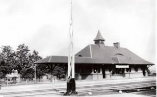 black and white photo of a train station building